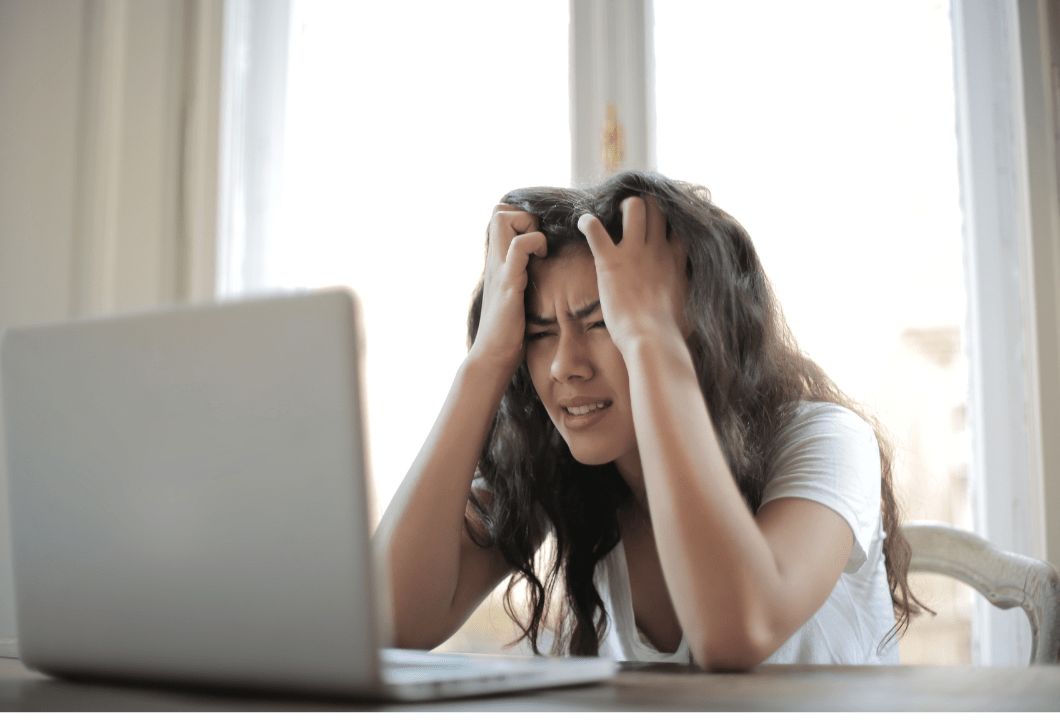 Woman stressed in front of computer