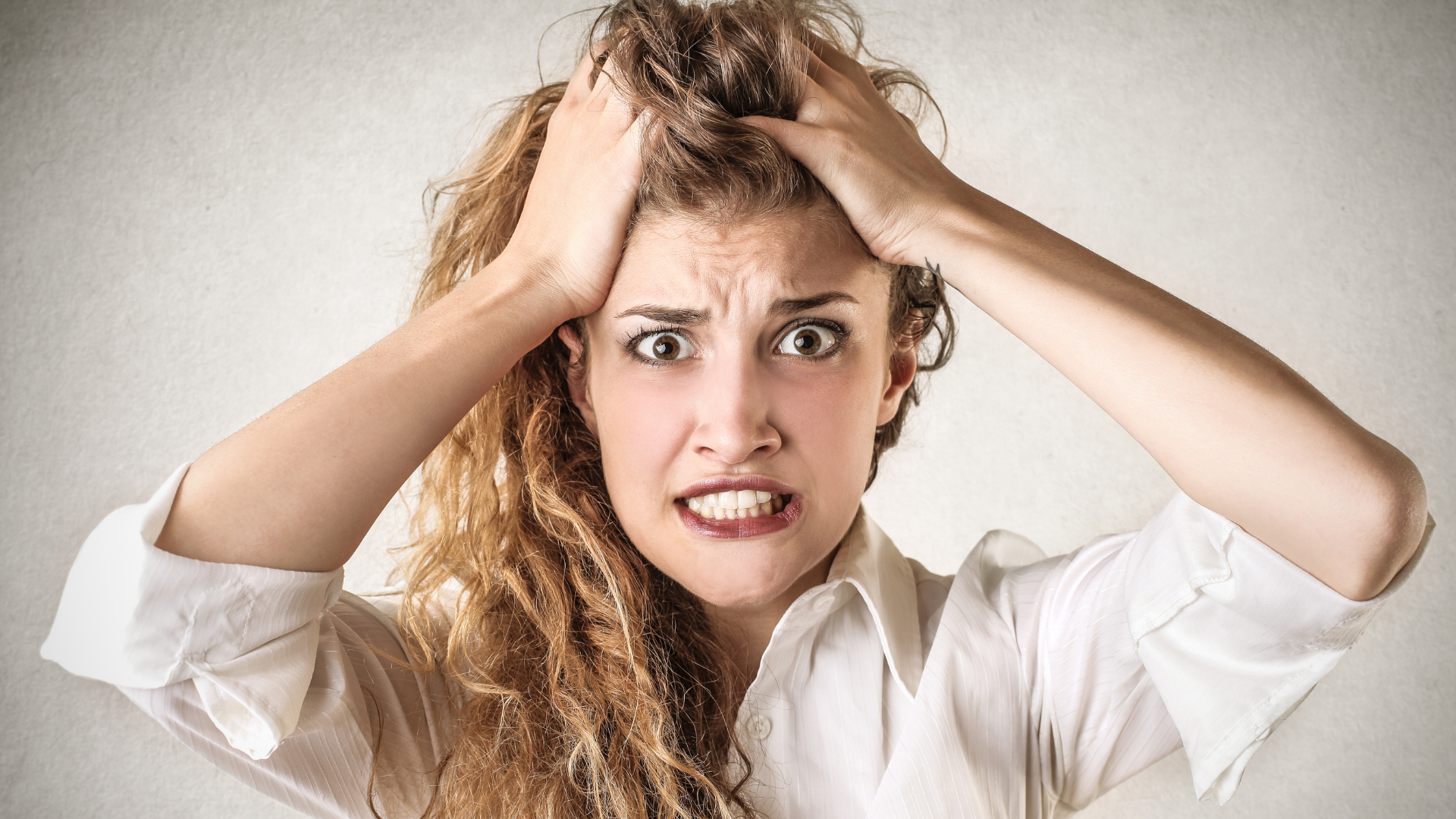Woman tearing her own hair because of Gut-Brain Axis issues